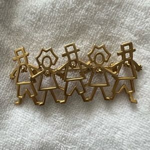 Outlined people pin with dangles.
